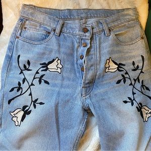 Designer jeans with floral embroidery light wash denim